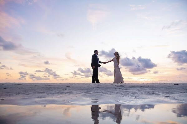 sunset photo of a bride and groom on clearwater beach