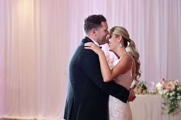 bride and groom during thier first dance at their sandpearl resort wedding