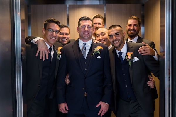 Groom and groomsmen in the elevator at the Hyatt Regency Clearwater