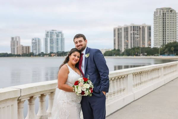 Bride and groom across the road from the Tampa Garden Club overlooking Tampa Bay