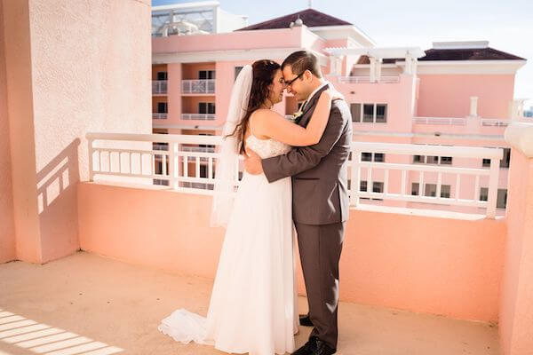 bride adn groom embracing after their first look on the rooftop of the Hyatt Clearwater Beach