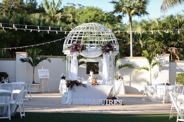 Sweetheart table under the wedding gazebo in the wedding garden at the Florida Botanical Gardens