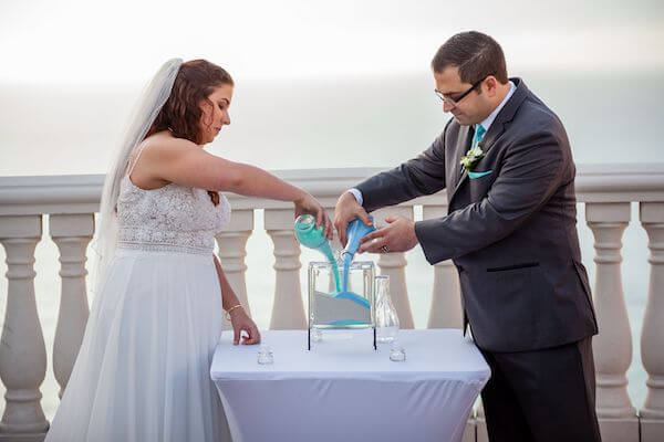 Bride and groom pouring sand during their Clearwater Beach wedding