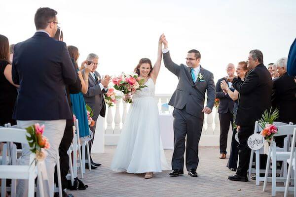 Just married, a bride and groom celebrate on the rooftop of the Hyatt Clearwater Beach