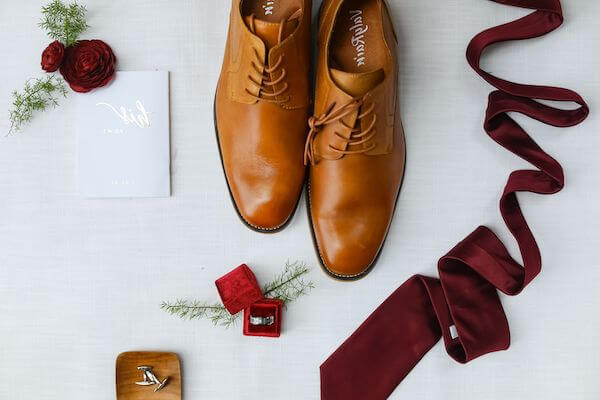 Flat lay photo of a groom's accessories