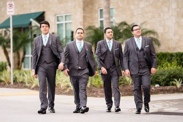 Groom and his groomsmen walking areound downtown Clearwater Beach