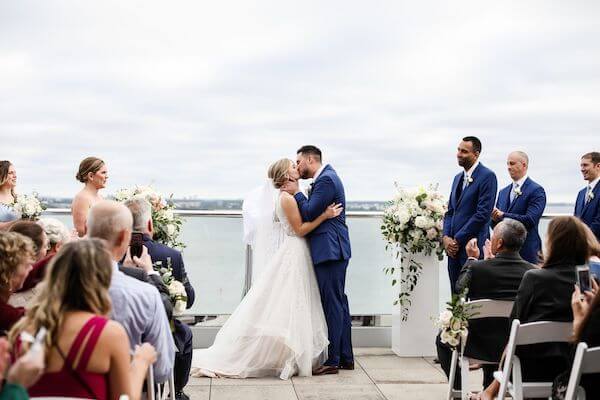 Tampa bride and groom kissing after thier waterfront wedding ceremony