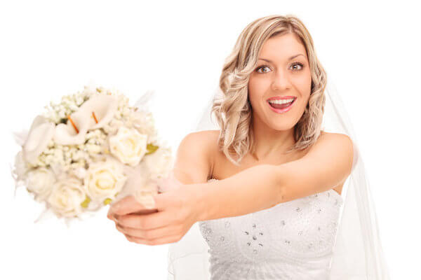 bride getting ready to toss her bridal bouquet