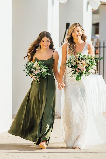 bride walking down the aisle with her daughter