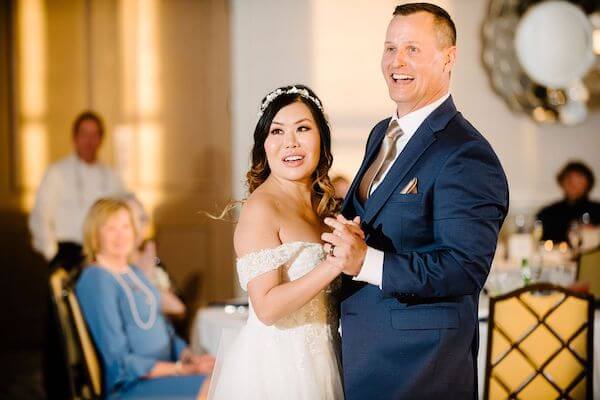 Stunned bride as the music changes in the middle of her first dance