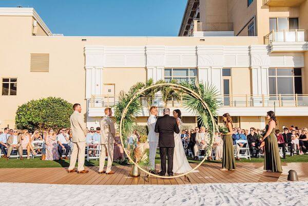 bride and groom exchanging wedding vows on Clearwater Beach