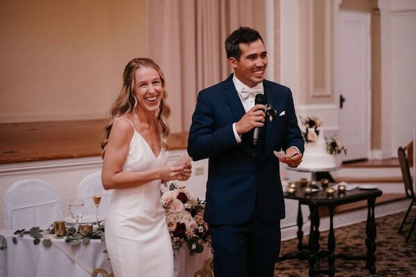 Bride and groom welcoming wedding guests to thier St Pete wedding reception