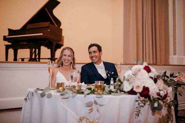 bride and groom laughing during wedding toasts at the St Pete Woman's Club