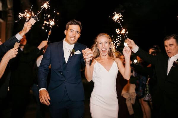 Excited St Pete bride and groom under a shower of sparklers