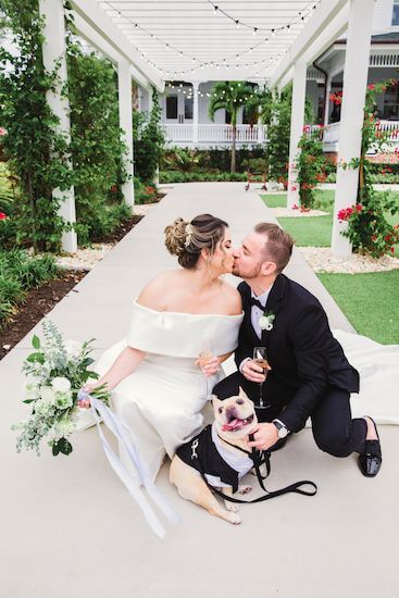 bride and groom with their dog after their Belleview Inn wedding