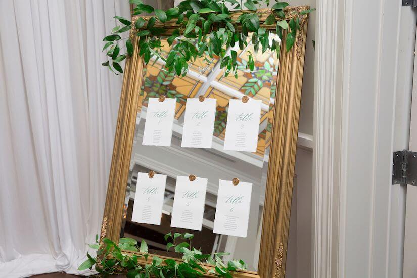 gold frame with wedding seating chart