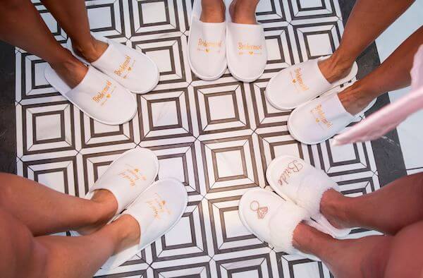 bride and her brides maids in special instagram able wedding slippers