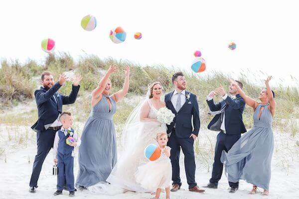 wedding party playing with beach balls