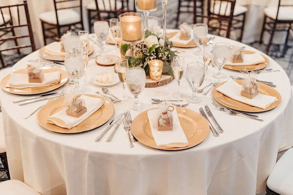 wedding reception with gold and ivory decor