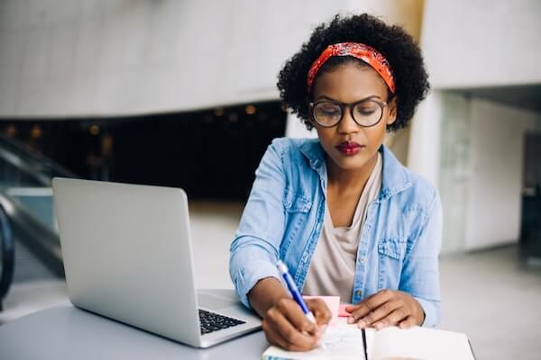 woman working on her wedding guest list