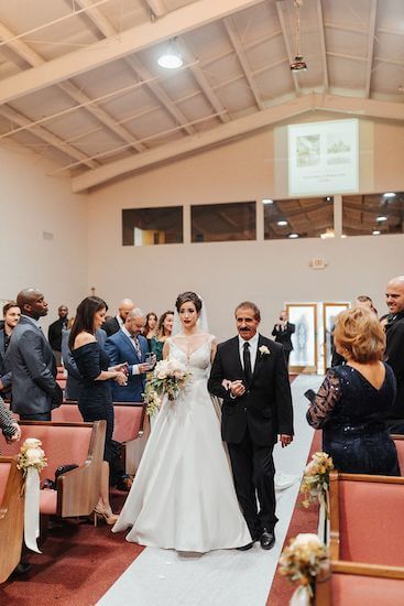 Tampa Bay bride walking down the aisle with her uncle