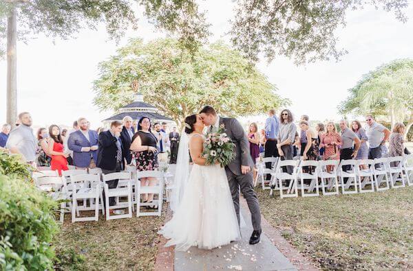 Bride and groom kissing after thier wedding ceremony