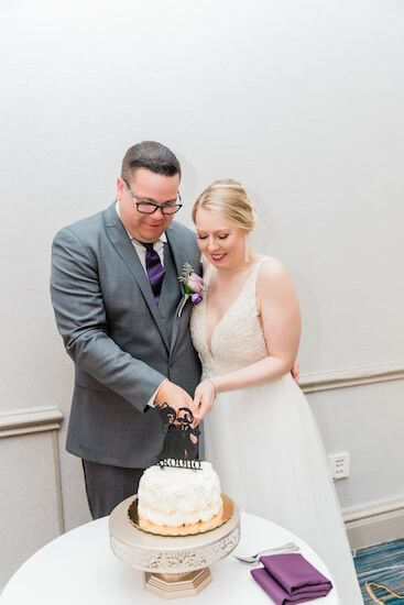 Tampa couple cutting thier intimate wedding cake