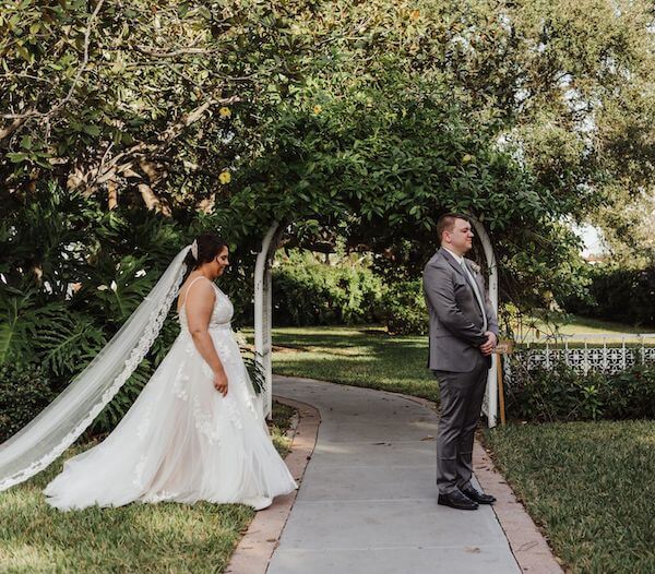 Bride walking up behind her groom for thier first look