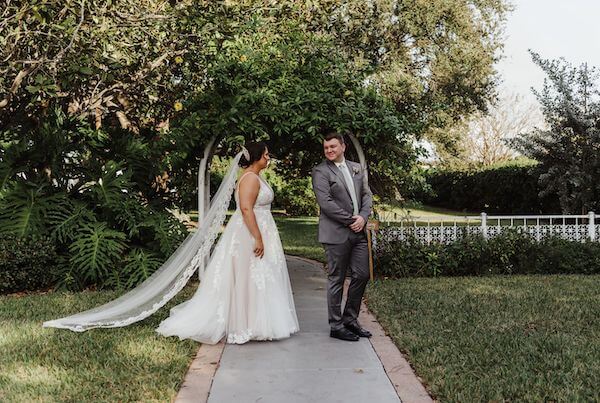 Groom seeing his bride for the first time before their David Islands Garden Club wedding