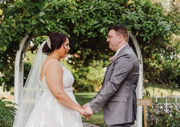 brid mand groom holding hands at Davis Islands Garden Club