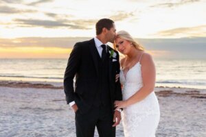 bride and groom on Clearwater Beach at sunset