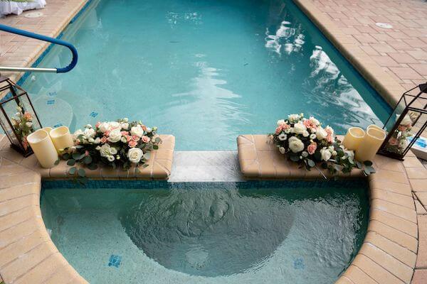 The pool at Belle Maison Beach House decorated for a wedding reception