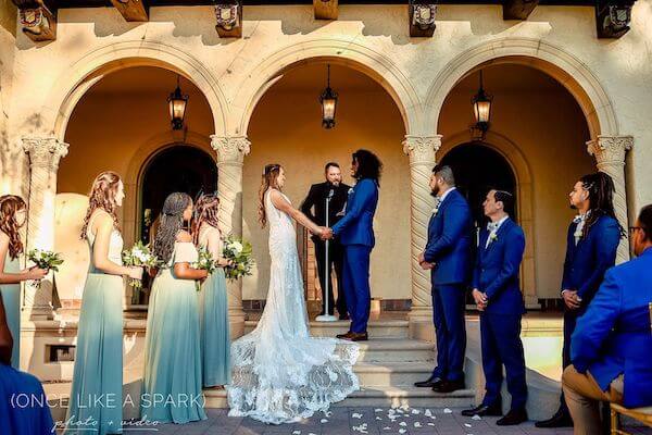 bride and groom exchanging wedding vows at Powel Crosley Estate Sarasota