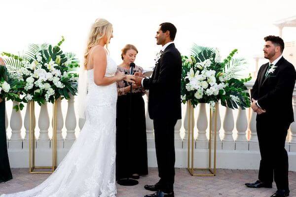 bride and groom exchanging wedding vows on the Sky Terrace at the Hyatt Regency Clearwater Beach