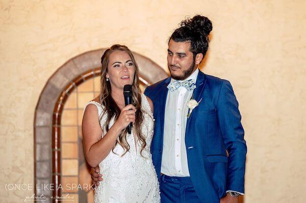 Bride and groom welcoming their wedding guests