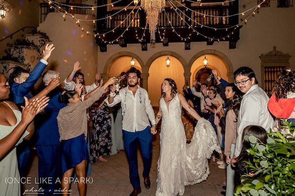 bride and groom exiting their wedding reception at the Powel Crosley Estate  in Sarasota