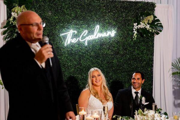 Father of the bride toasting his daughter and son in law