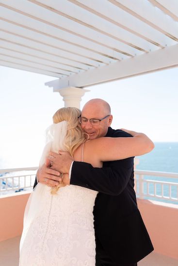 bride hugging her dad after their first look