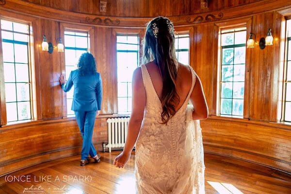 bride approaching her groom for their first look 