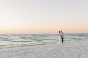 newlywed couple after their beach wedding