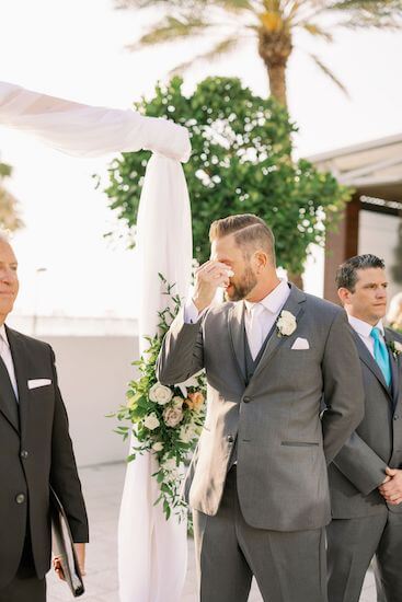 groom getting emotions seeing his bride for the first time