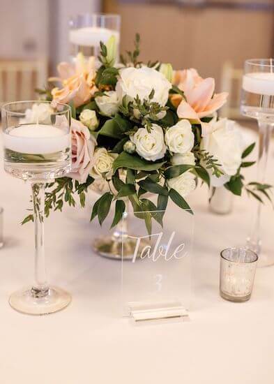 floral centerpiece surrounded by floating candles