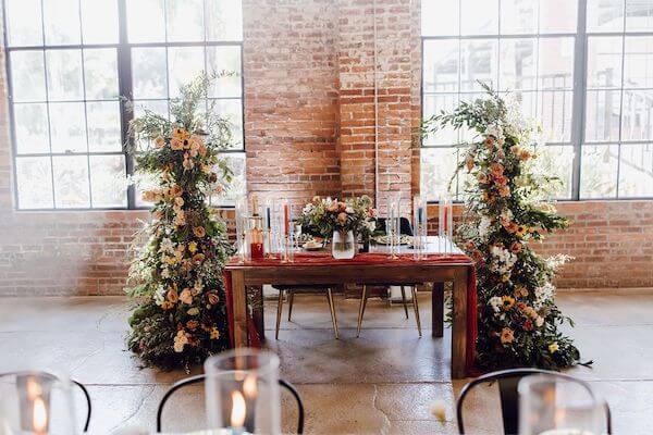 Ceremony flowers repurposed for the couple's sweetheart table