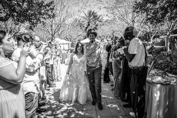 Bride and groom's grand exit under a shower of bubbles at the Florida Botanical Gardens