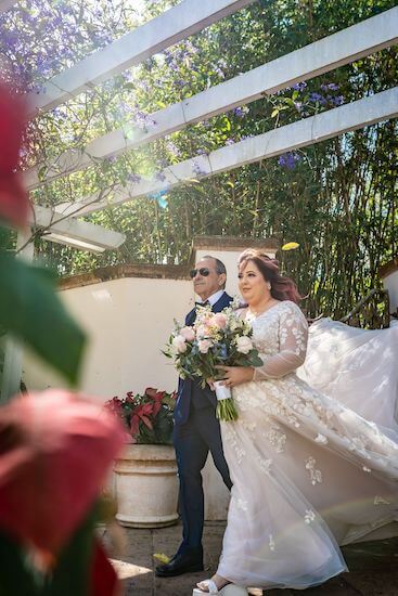 Bride won't be late for her wedding ceremony as she's escorted down the aisle