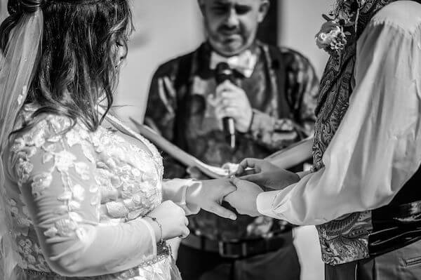 Bride and groom exchanging wedding voes for a very important date