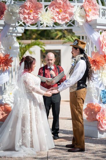 Bride and groom exchanging wedding voes for a very important date