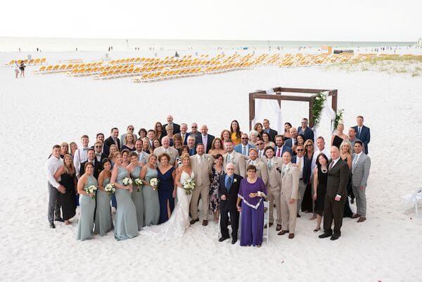 Bride , groom and their family on Clearwater Beach