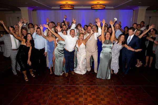 Bride and groom with all of their wedding guests 