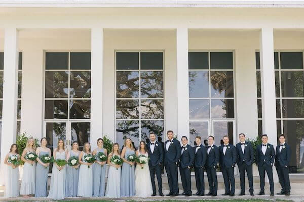 Bride, groom and wedding party in front of the Tampa Garden Club